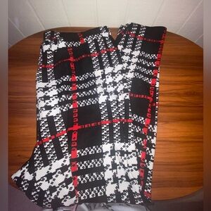 Black and white plaid pants with red and white accents
